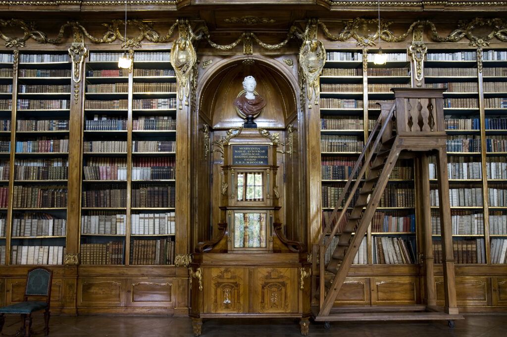 Strahov Library Prague Baroque bookshelf with large rolling wooden ladder.